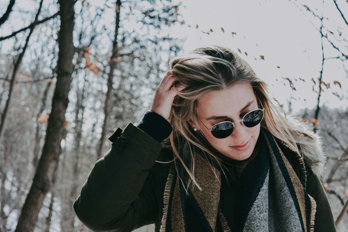 Blonde Woman Touching Her Hair Outdoors